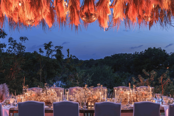 lavish wedding table decor at dusk overlooking jungle